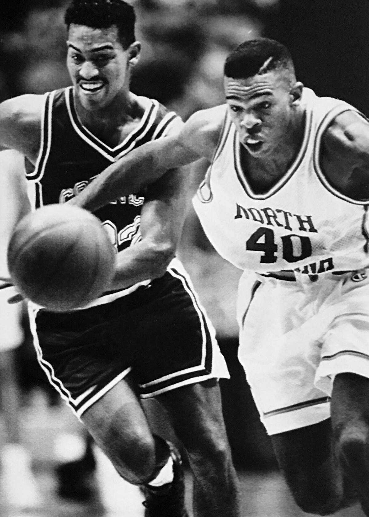 As a UNC player, Hubert Davis, right, goes after the ball in a game against Cornell in 1991.
