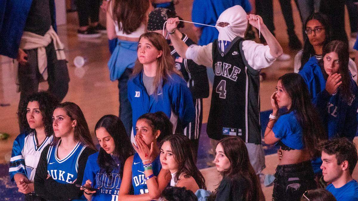 Duke students at Cameron Indoor Stadium react after losing to UNC 81-77 in the Final Four Saturday, April 7, 2022.