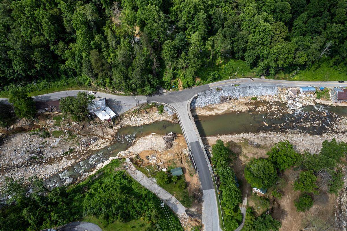 A view from the bridge where U.S. 64/74A intersect in Bat Cave on Friday, June 13, 2025, after Hurricane Helene devastated the area. A temporary road now connects Bat Cave and Chimney Rock after the storm destroyed a 2.5-mile stretch of U.S. 64/74A through Hickory Nut Gorge—one of the most severely damaged and costly road repairs in the state.