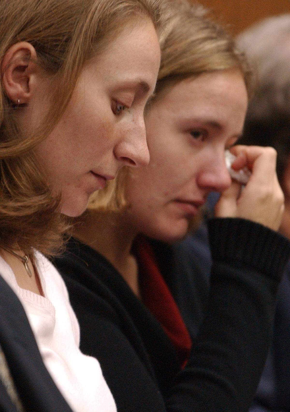 Margaret (at left) and Martha Ratliff listen in the courtroom after reading a letter from the early 90’s from Michael Peterson, their legal guardian, to their aunt Margaret Blair, explaining why he didn’t think the girls should be adopted.