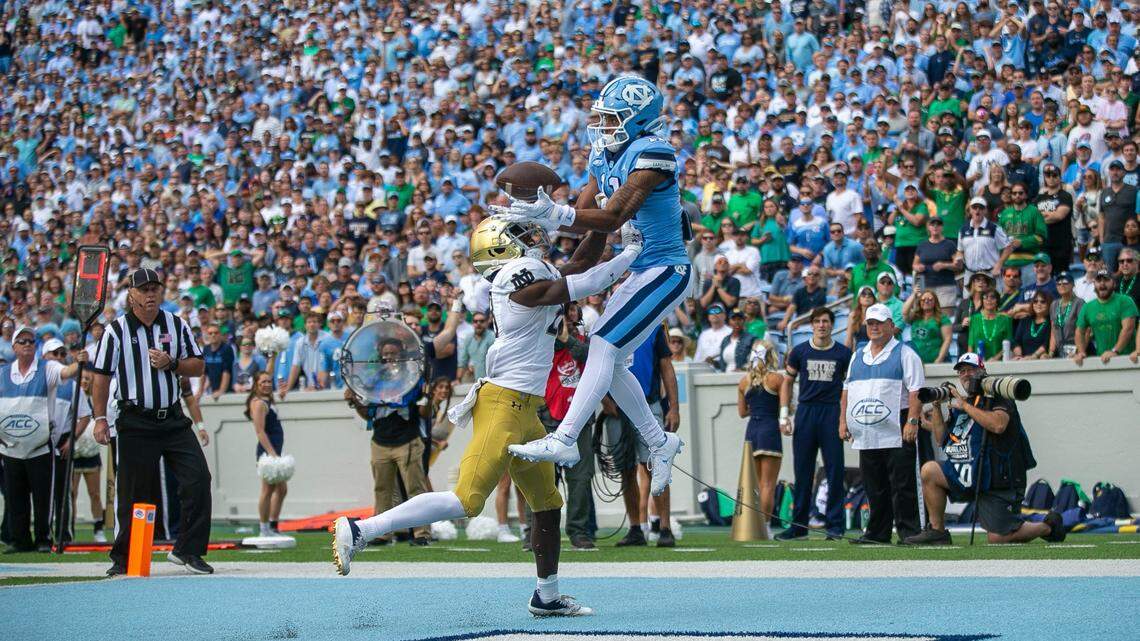 North Carolina’s Josh Downs (11) scores on a four yard pass from quarterback Drake Maye to give the Tar Heels’ a 7-0 lead in the first quarter against Notre Dame on Saturday, September 24, 2022 at Kenan Stadium in Chapel Hill, N.C.