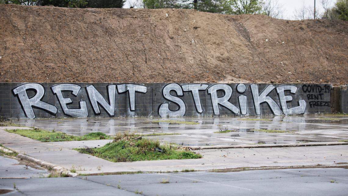 A message calling for freezing rent during the COVID-19 outbreak was spray painted on a wall in an abandoned parking lot in Durham, N.C., pictured here on Wednesday morning, March 25, 2020.