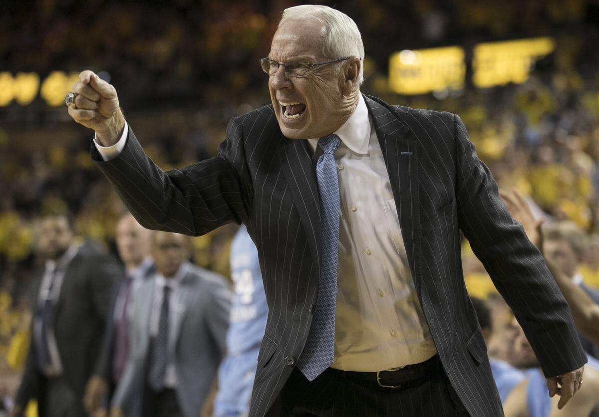 North Carolina Roy Williams, frustrated by poor play, directs his team on offense during the second half against Michigan on Wednesday, November 28, 2018 during the ACC-Big Ten Challenge at Crisler Center in Ann Arbor, MI.