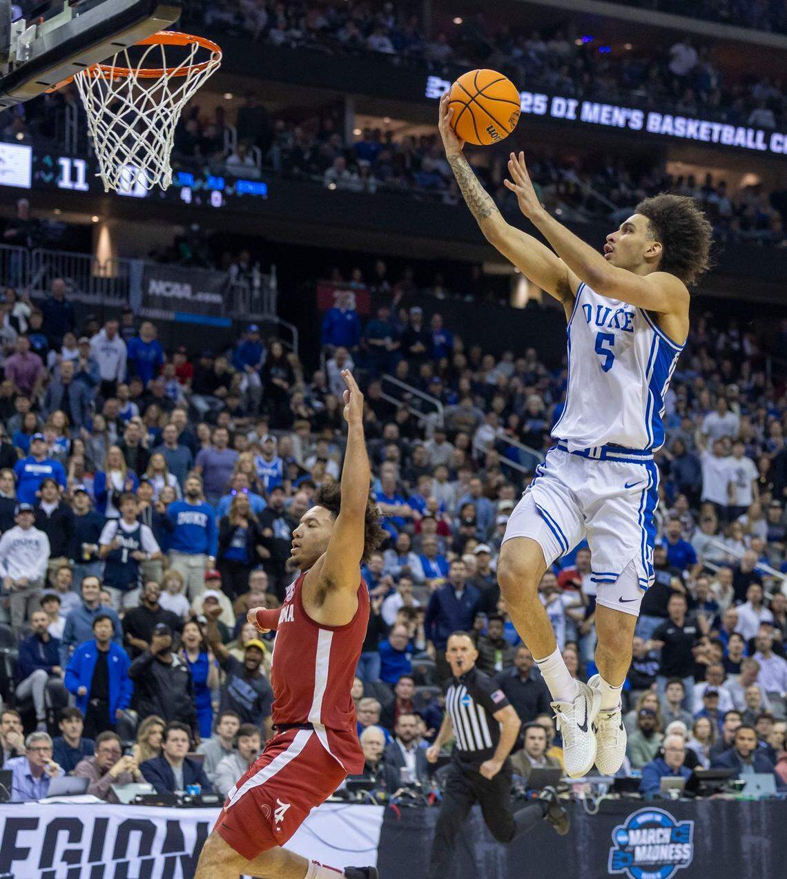Duke guard Tyrese Proctor (5) breaks to the basket against Alabama’s Mark Sears (1) in the first half on Saturday, March 29, 2025 during the NCAA East Regional final at Prudential Center in Newark, N.J.