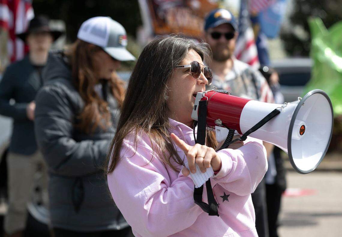 Michele Morrow of Cary, N.C. works to unify a crowd of more than 100 activists who gathered to protest a variety of topics across the street from The Executive Mansion in Raleigh, N.C. on Saturday, March 20, 2021.