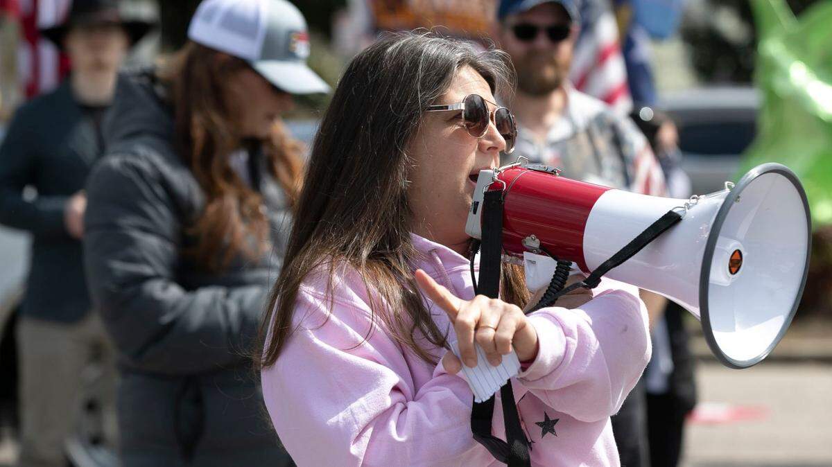 Michele Morrow of Cary, N.C., speaks to a crowd of activists who gathered to protest a variety of topics across the street from The Executive Mansion in Raleigh, N.C. on Saturday, March 20, 2021.