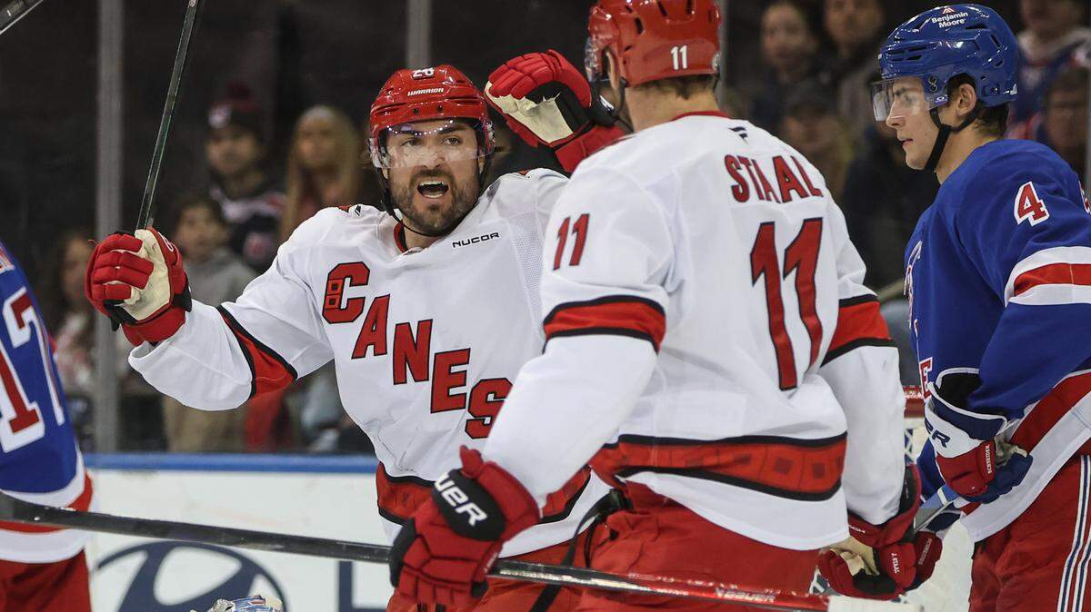 Carolina Hurricanes left wing William Carrier (28) celebrates with center Jordan Staal (11) after scoring a goal in the second period against the New York Rangers at Madison Square Garden.