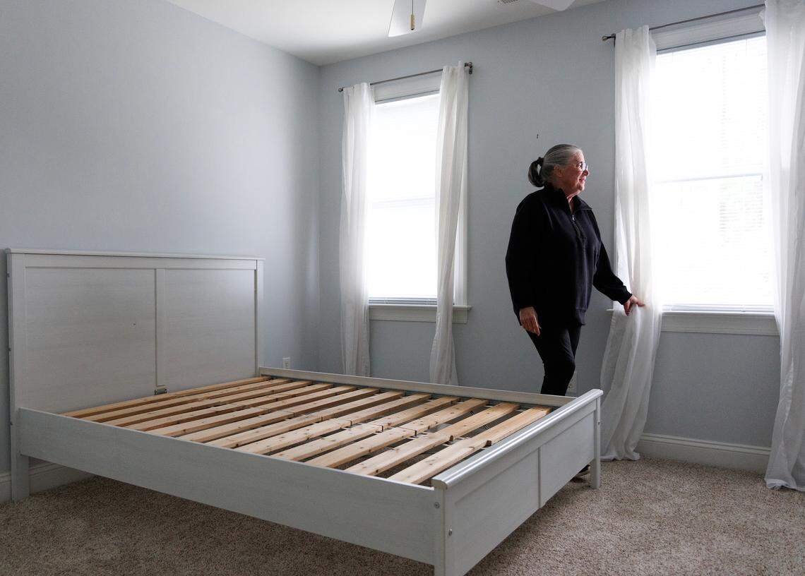 Annabella Vagonis walks through a bedroom in her new home in Chapel Hill, N.C. Vagonis recently relocated to the Triangle from Northern Virginia, where her family lived for decades.
