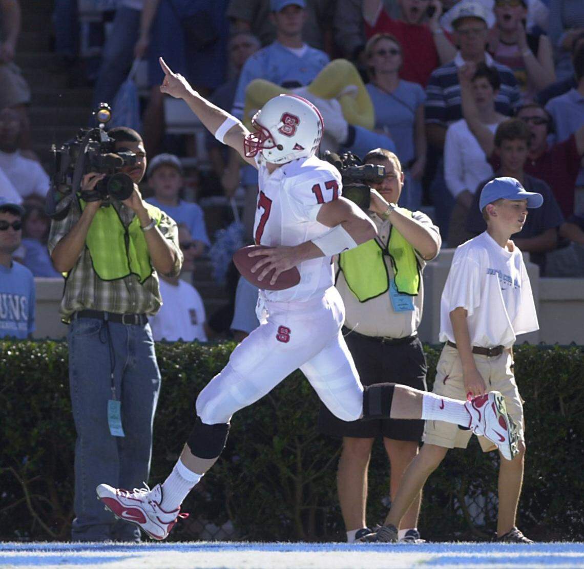 N.C. State quarterback Philip Rivers celebrates his touchdown catch during their game against UNC in 2000.