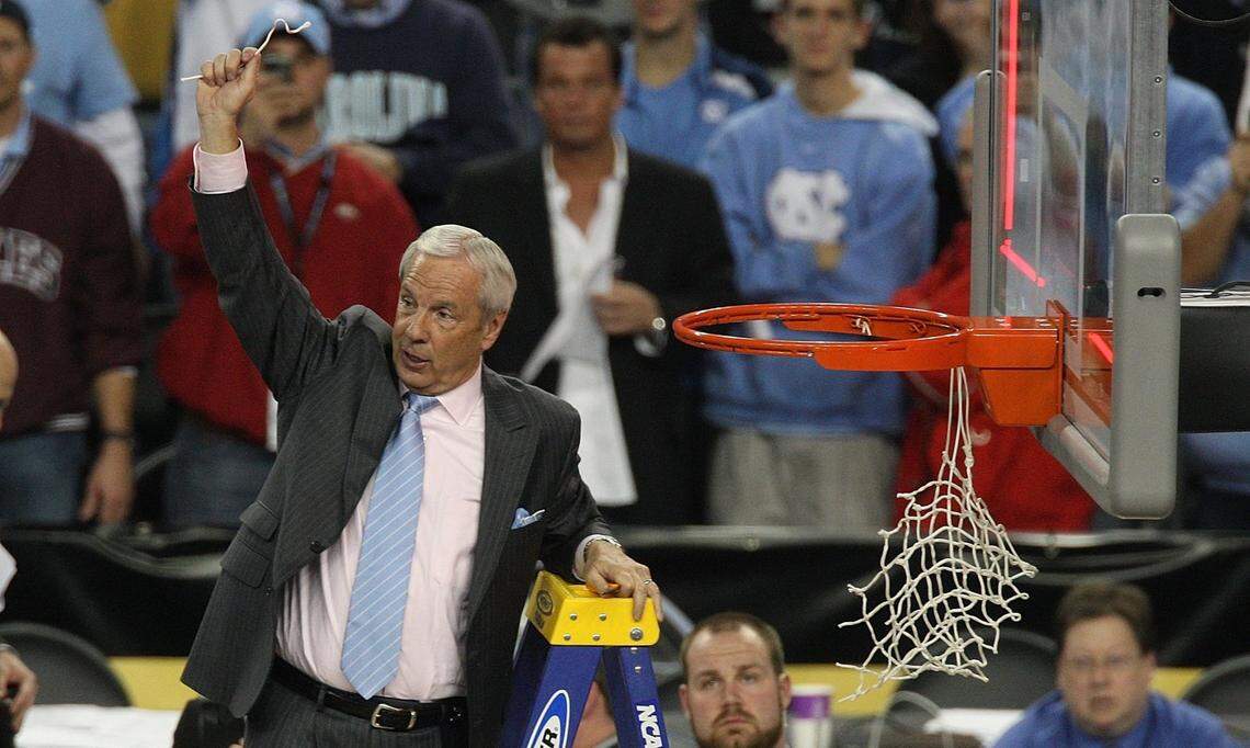 North Carolina head coach Roy Williams cuts down the nets at Ford Field in Detroit, Michigan Monday April 6, 2009
