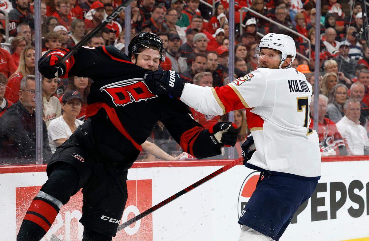 The Panthers’ Dmitry Kulikov (7) pushes off Carolina’s Eric Robinson (50) during the first period of the Carolina Hurricanes’ game against the Florida Panthers in Game 1 of the Eastern Conference Finals at the Lenovo Center in Raleigh, N.C., Tuesday, May 20, 2025.