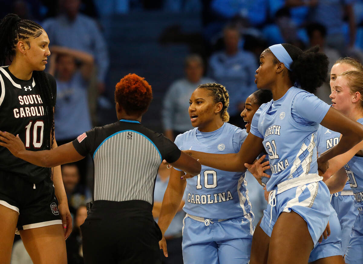 An official separates South Carolina’s Kamilla Cardoso and North Carolina players during the first half of the Tar Heels’ 65-58 loss on Thursday, Nov. 30, 2023, at Carmichael Arena in Chapel Hill, N.C.