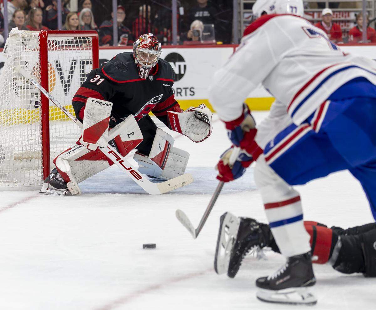 Carolina Hurricanes goalie Frederik Andersen (31) eyes a scoring attempt by Montreal center Kirby Dach (77) in the second period during Game 5 of the Eastern Conference Finals against Montreal on Friday, May 29, 2026 at Lenovo Center in Raleigh, N.C.