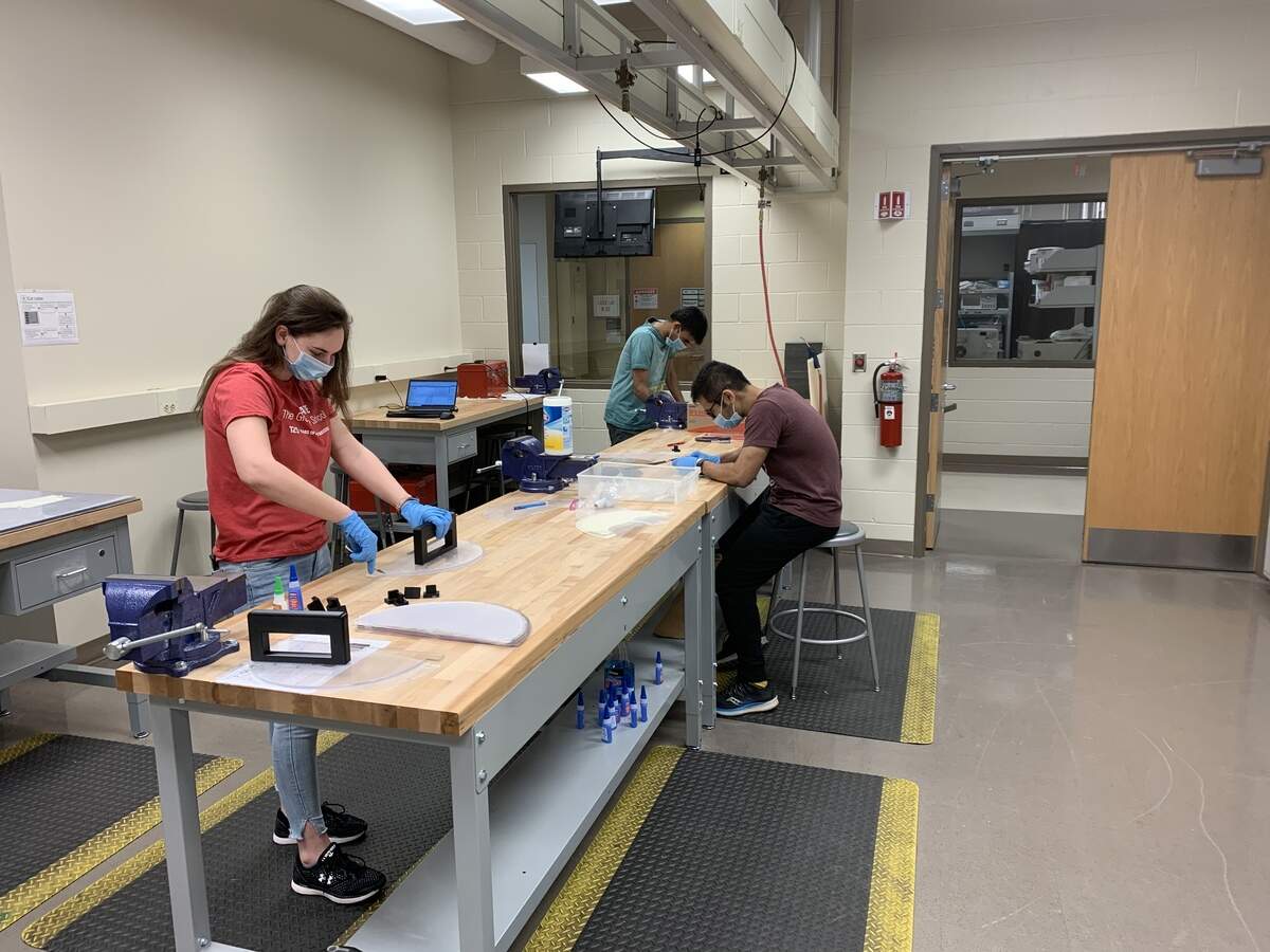 About 20 graduate student volunteers are working on the designs and assembly of the face shields at the Mechanical and Aerospace Engineering machine shop on campus.