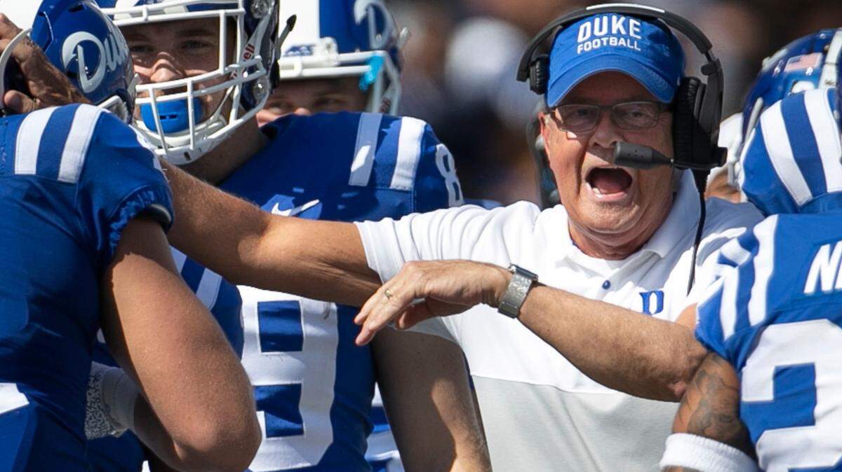 Duke coach David Cutcliffe congratulates Duke’s Xander Gagnon (41) after he blocked a punt by Georgia Tech’s Pressley Harvin III (27) in the second quarter on Saturday October 12, 2019 at Wallace Wade Stadium in Durham, N.C.