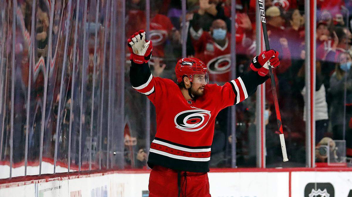 Carolina Hurricanes’ Brendan Smith celebrates his go-ahead goal against the St. Louis Blues during the third period of an NHL hockey game in Raleigh, N.C., Saturday, Nov. 13, 2021. (AP Photo/Karl B DeBlaker)