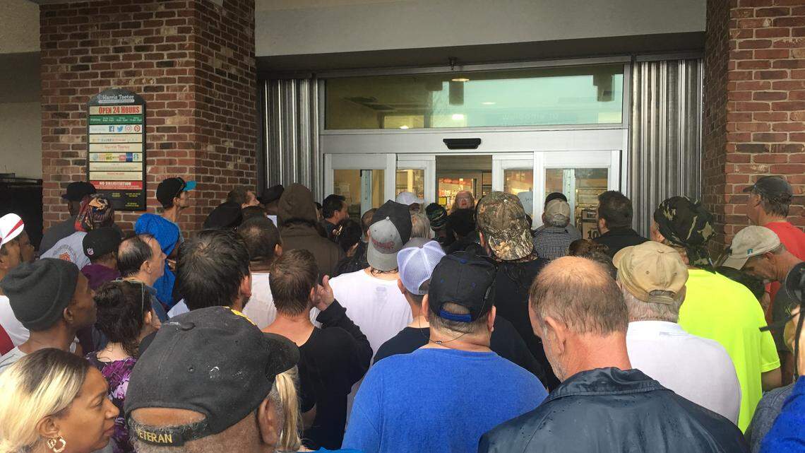 More than 500 people flooded Harris Teeter, the first grocery to open since Hurricane Florence cut power to the city Thursday night. Photo by Josh Shaffer