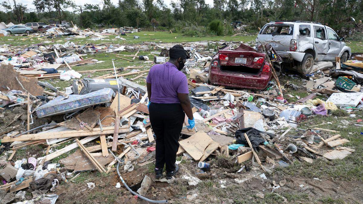 Cynthia Cooper looks for personal items for a family member who had their home destroyed after a tornado spawned by Hurricane Isaias destroyed a rural mobile home neighborhood killing two residents on Morning Road near Windsor N.C. on Wednesday, August 5, 2020. The photo took second place for spot photography among the state’s largest newspapers in the North Carolina Press Association’s annual awards.