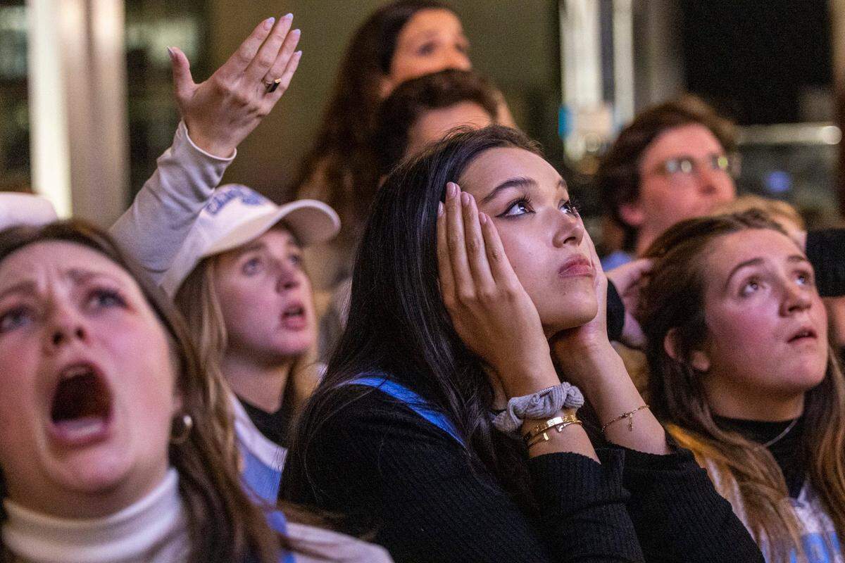 UNC fans watch the final moments of the NCAA Men’s Division I Basketball Championship against Kansas Monday, April 4, 2022 at Top of the Hill Restaurant & Brewery in Chapel Hill. UNC lost 72-69.