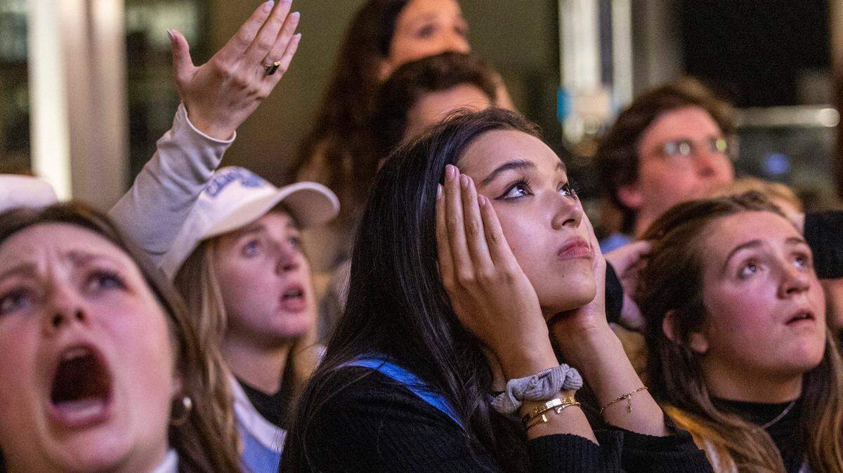 UNC fans watch the final moments of the NCAA Men’s Division I Basketball Championship against Kansas Monday , April 4, 2022 at Top of the Hill Restaurant & Brewery in Chapel Hill. UNC lost 69-72.