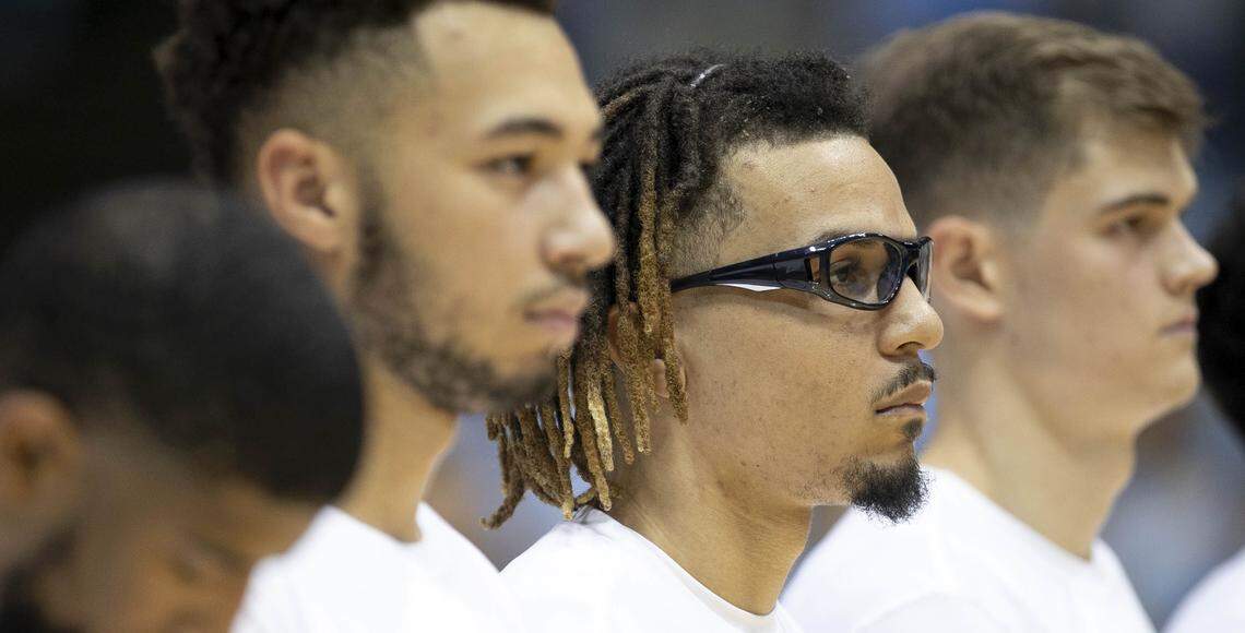 North Carolina’s Cole Anthony (2) sports a pair of glasses as he stands with his teammates for the National Anthem prior to the Tar Heels’ game against Notre Dame on Wednesday November 6, 2019 at the Smith Center in Chapel Hill, N.C.