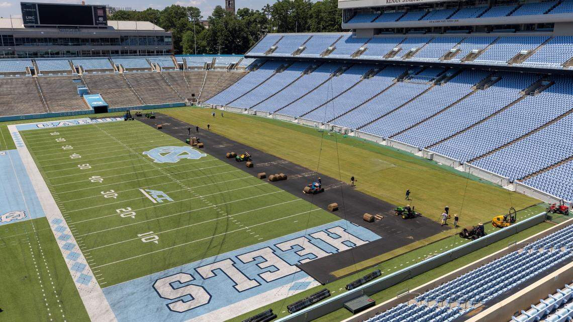 Crews from Carolina Green and the University of North Carolina Turf Management install nearly 100,000 square feet of fresh sod atop the artificial turf in Kenan Stadium in preparation for the FC Series game between Chelsea and Wrexham on Wednesday, July 12, 2023 in Chapel Hill, N.C. The Bermuda 419 sod was grown in Indian Trail, N.C., is 1.5 inches thick, and was installed upon a layer of geo-textile base over the artificial turf, which will be removed following the soccer match on July 19, 2023.