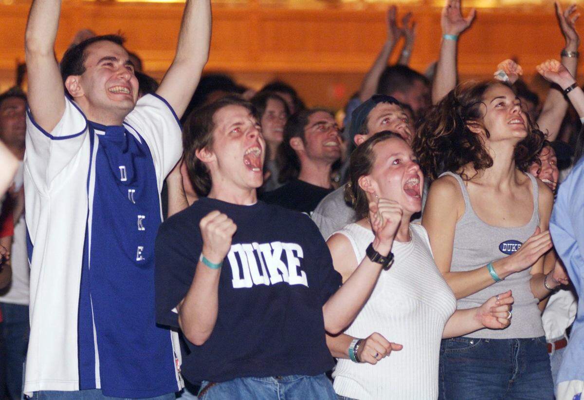 Duke fans celebrate March 31, 2001 in Cameron Indoor Stadium as the basketball team advances to the NCAA championship game after defeating Maryland.