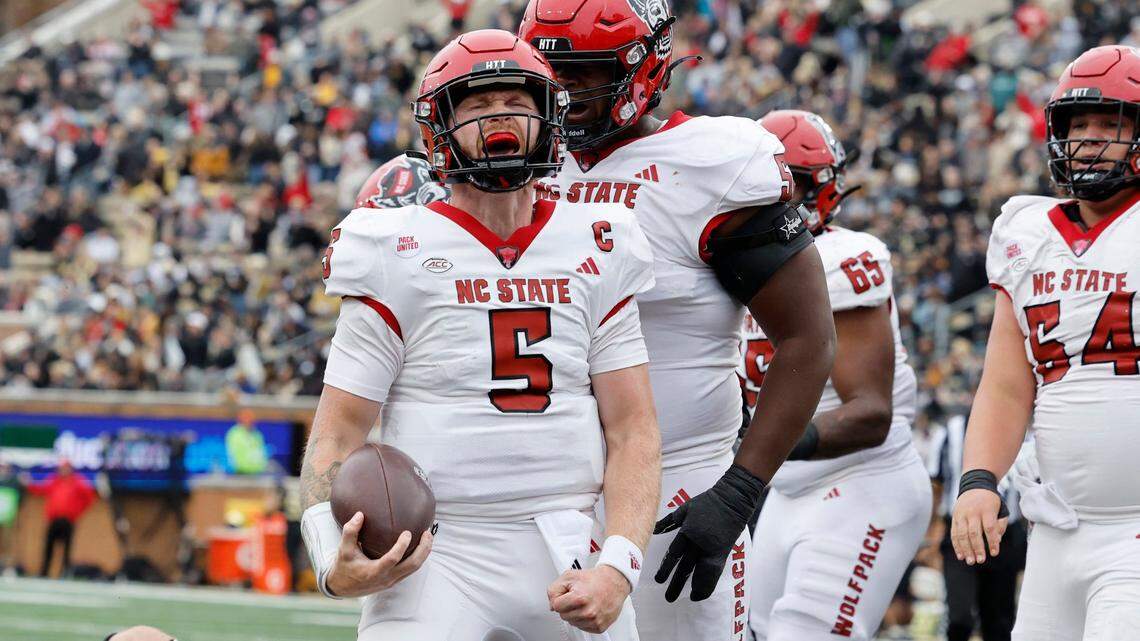 N.C. State quarterback Brennan Armstrong (5) celebrates after scoring on a one-yard touchdown run during the first half of N.C. State’s game against Wake Forest at Allegacy Stadium in Winston-Salem, N.C., Saturday, Nov. 11, 2023.