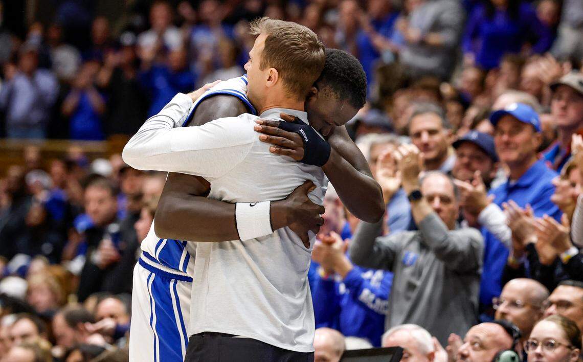 Duke head coach Jon Scheyer hugs Khaman Maluach (9) as he comes off the floor late in the second half of Duke’s 93-60 victory over Wake Forest at Cameron Indoor Stadium in Durham, N.C., Monday, March 3, 2025.