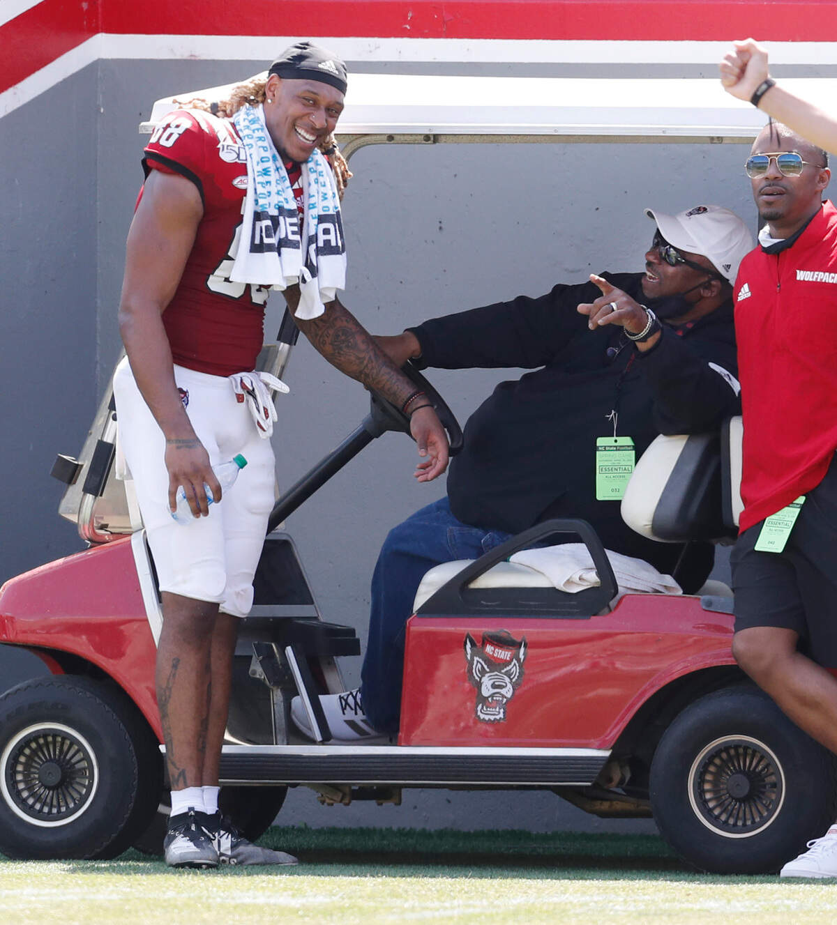 N.C. State special assistant to the head coach Ruffin McNeill laughs with former wide receiver Devin Carter (88) during the Wolfpack’s spring game at Carter-Finley Stadium in Raleigh, N.C., Saturday, April 10, 2021.