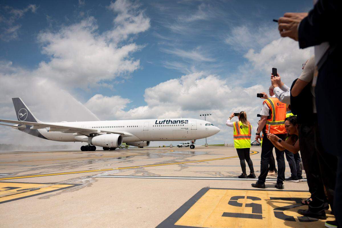 People gather to document and celebrate the arrival of the first direct Lufthansa flight from Frankfurt, Germany to Raleigh Durham International Airport on June 6, 2024.