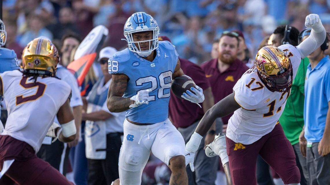 North Carolina running back Omarion Hampton (28) picks up 17 yards in the fourth quarter against Minnesota on Saturday, September 16, 2023 at Kenan Stadium in Chapel Hill N.C.