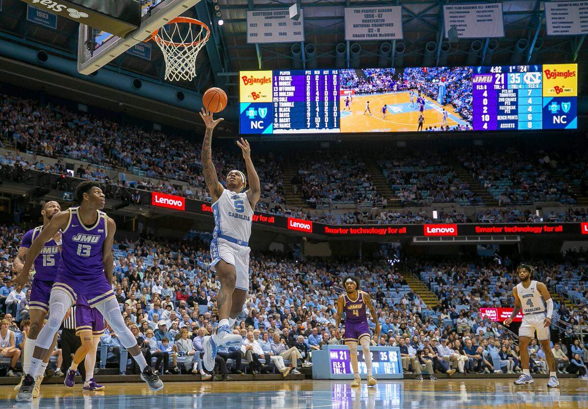 North Carolina’s Armando Bacot (5) puts up a shot against James Madison’s Mezzo Offurum (13) in the first half on Sunday, November 20, 2022 at the Smith Center in Chapel Hill, N.C.