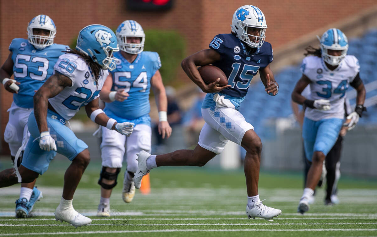 North Carolina quarterback Connor Harrell (15) breaks open for a long run during the Tar Heels’ spring football game on Saturday, April 15, 2023 at Kenan Stadium in Chapel Hill, N.C.