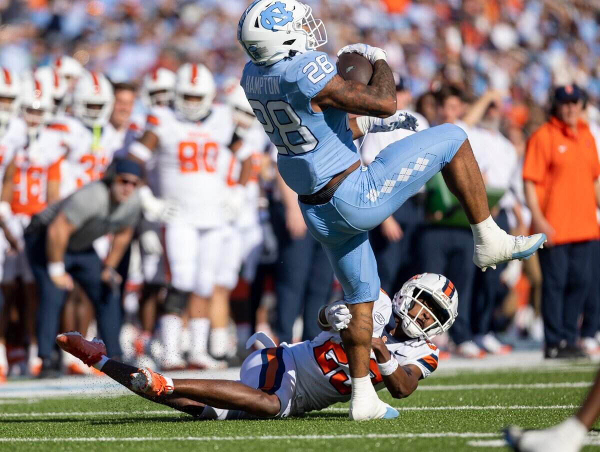 North Carolina running back Omarion Hampton (28) carries the ball for six yards in the first quarter against Syracuse on Saturday, October 7, 2023 at Kenan Stadium in Chapel Hill, N.C.
