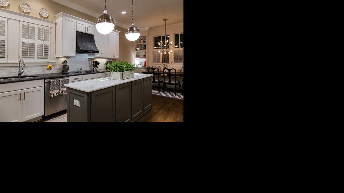 The original kitchen in this 1930s home was a confined, 13-by-13-foot space. To make it more functional and retain its traditional character, a wall was removed to create an open space, and a breakfast nook was added. 
