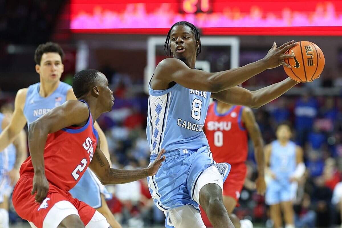 DALLAS, TEXAS - JANUARY 03: Caleb Wilson #8 of the North Carolina Tar Heels drives with the ball against Boopie Miller #2 of the SMU Mustangs during the first half at Moody Coliseum on January 03, 2026 in Dallas, Texas. (Photo by Sam Hodde/Getty Images)