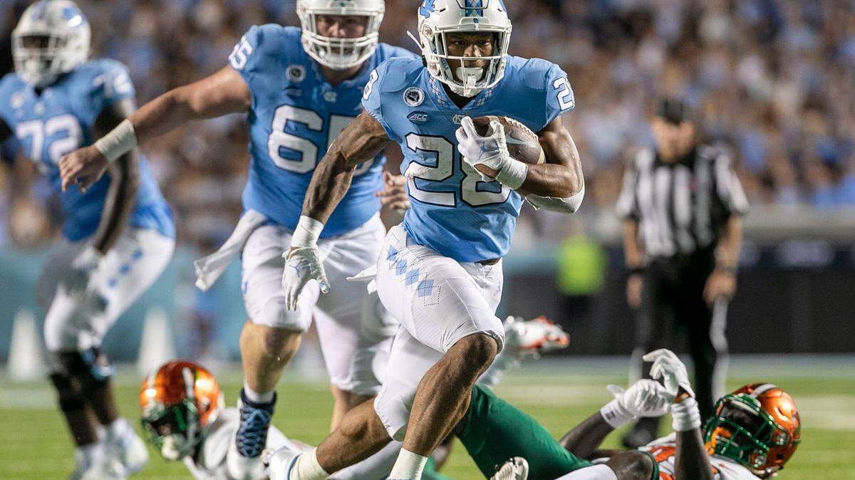 North Carolinas Omarion Hampton (28) picks up 18 yards in the second quarter against Florida A&M to set up a touchdown on Saturday, August 27, 2022 at Kenan Stadium in Chapel Hill, N.C.