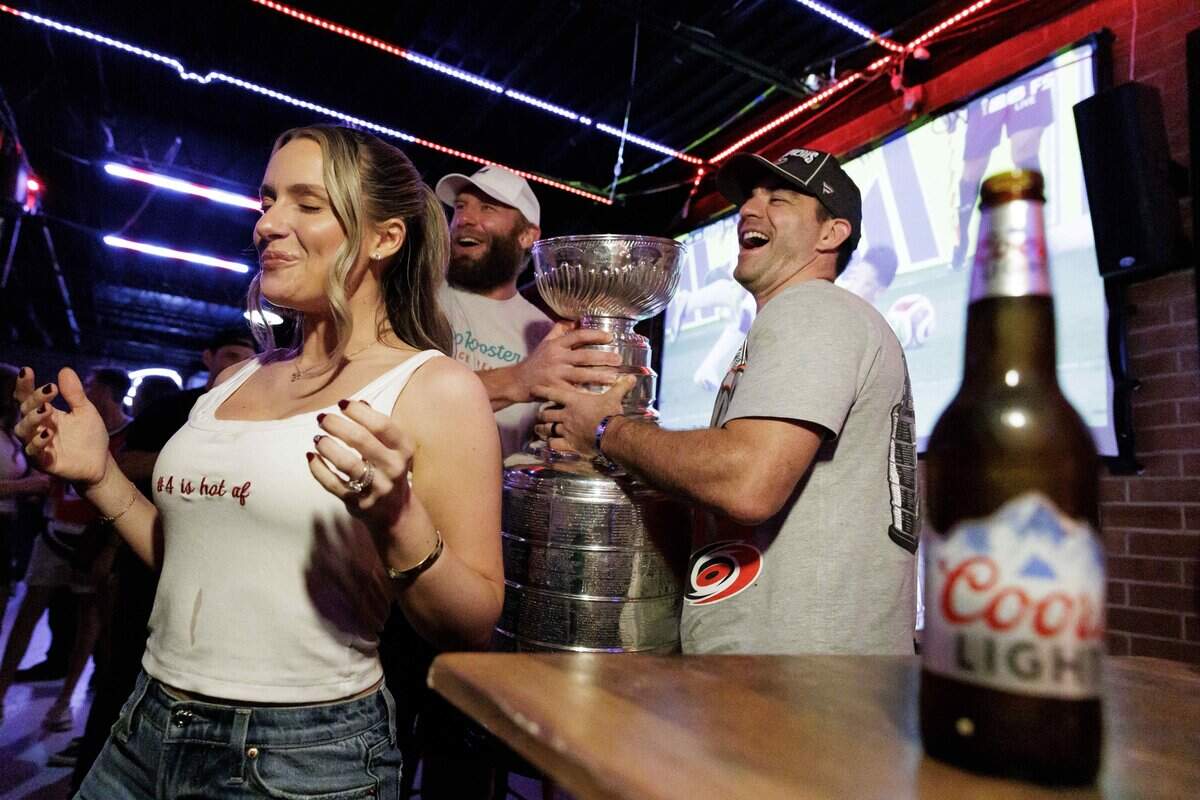 The Stanley Cup makes an appearance at Teets bar in Raleigh's Glenwood South district on Monday, June 15, 2026, as Carolina Hurricanes fans celebrated with the team’s players and staff following the Hurricanes’ Stanley Cup final 4-2 victory over the Vegas Golden Knights the evening prior.