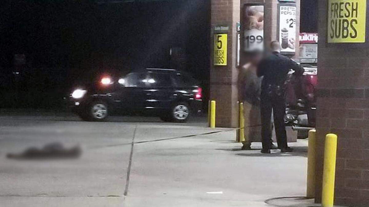 A photo posted to Facebook by a person who witnessed deputies confronting a man about a dog dragged behind a truck in Spartanburg, SC on Friday, Sept. 7, 2018.