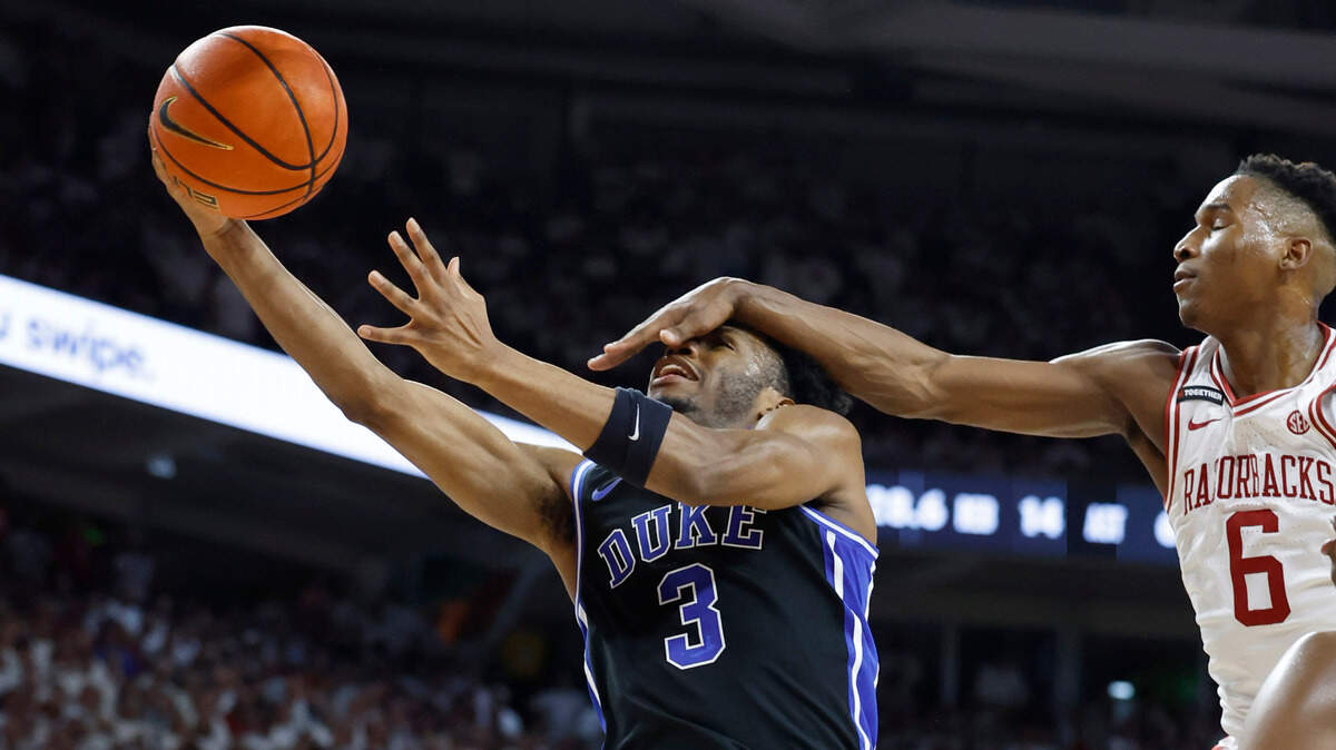 Duke’s Jeremy Roach (3) is fouled by Arkansas’ Layden Blocker (6) during the first half of Duke’s game against Arkansas at Bud Walton Arena in Fayetteville, Ark., Weds. Nov. 29, 2023.