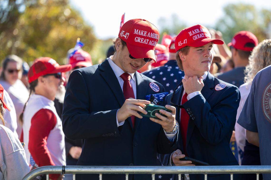 Supporters of former President Donald Trump gather outside Minges Coliseum in Greenville prior to a rally on Monday, Oct. 21, 2024. With two weeks until Election Day, Trump went on a three-city tour, in which Trump will also see the destruction caused by Hurricane Helene in Asheville and speak at a faith conference in Concord.