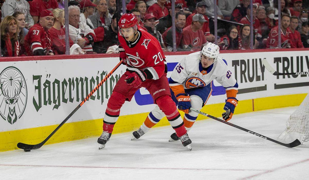 Carolina Hurricanes’ Sebastian Aho (20) moves the puck ahead of New York Islanders’ Sebastian Aho (25) in the first period during game two of their Stanley Cup series on Wednesday, April 19, 2023 at PNC Arena in Raleigh, N.C.