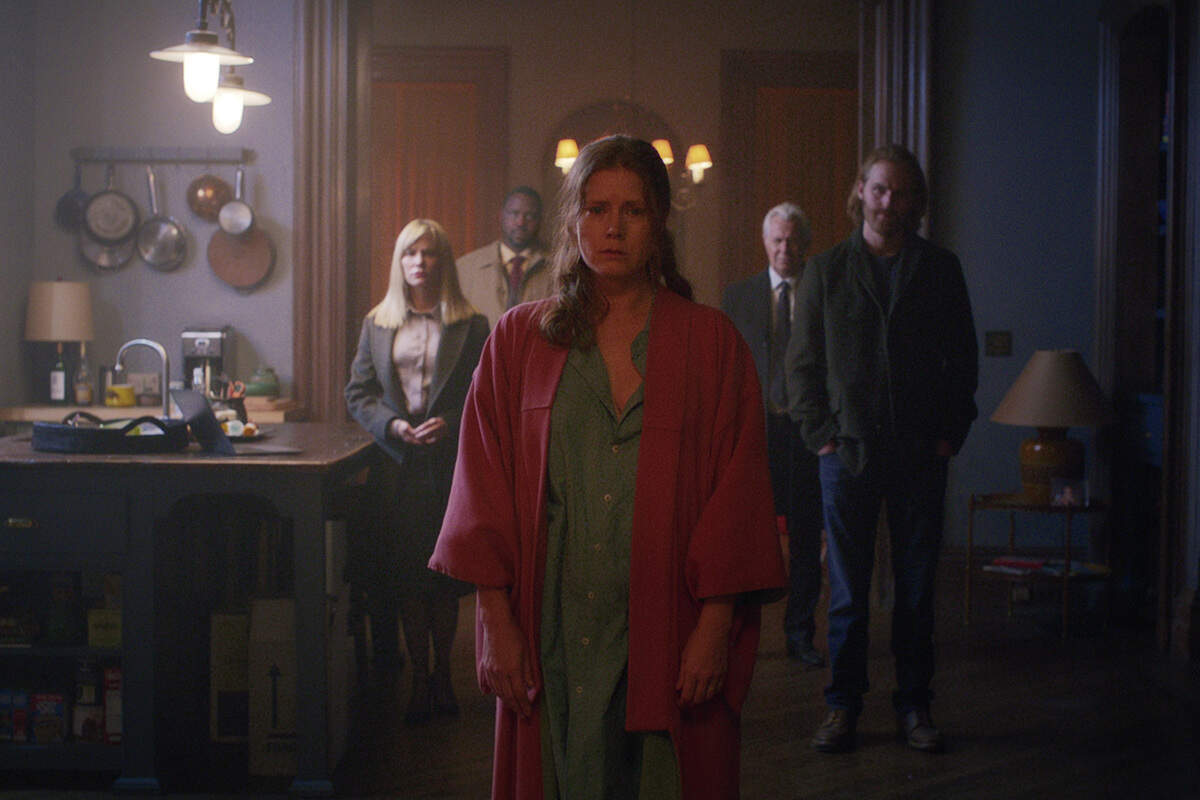 Amy Adams (center) is Anna Fox in the Netflix original movie “Woman in the Window.” Also pictured, left to right: Jennifer Jason Leigh as Jane Russell, Brian Tyree Henry as Detective Little, Gary Oldman as Alistair Russell and Wyatt Russell as David.