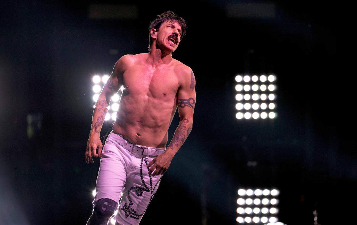 Lead singer Anthony Kiedis circles the stage as Red Hot Chili Peppers play a sold-out show in Raleigh, Wednesday, June 26, 2024.