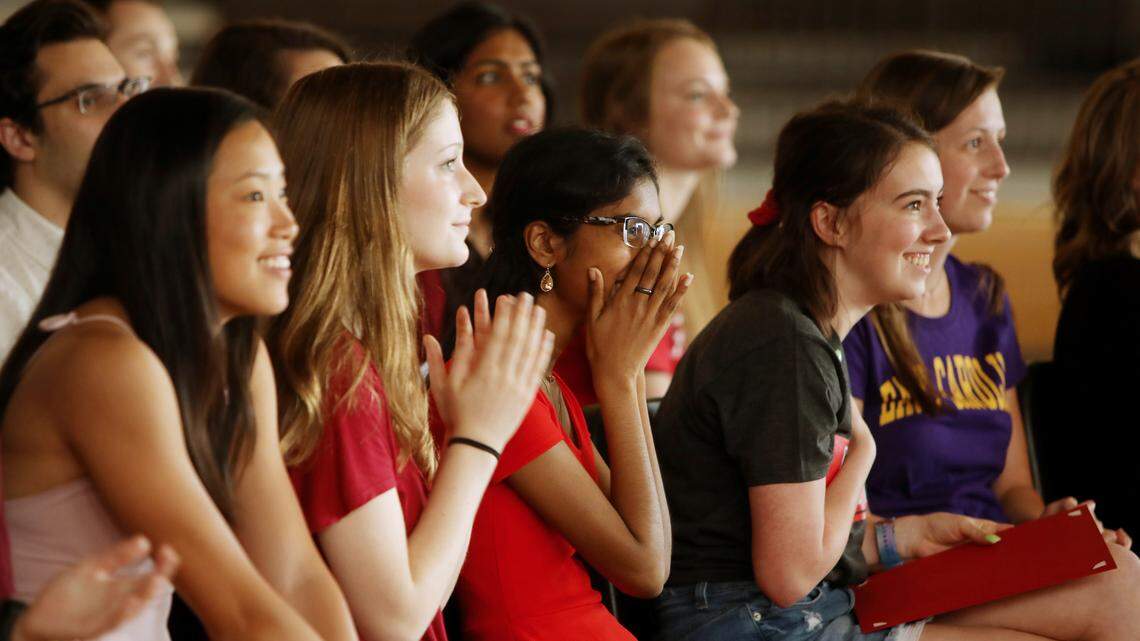 Panther Creek High School senior Akhila Koripella, center, reacts to good news during a ceremony held for seniors at the Cary high school on Friday, May 31, 2019. Koripella had just accepted a National Merit scholarship to the University of Texas.