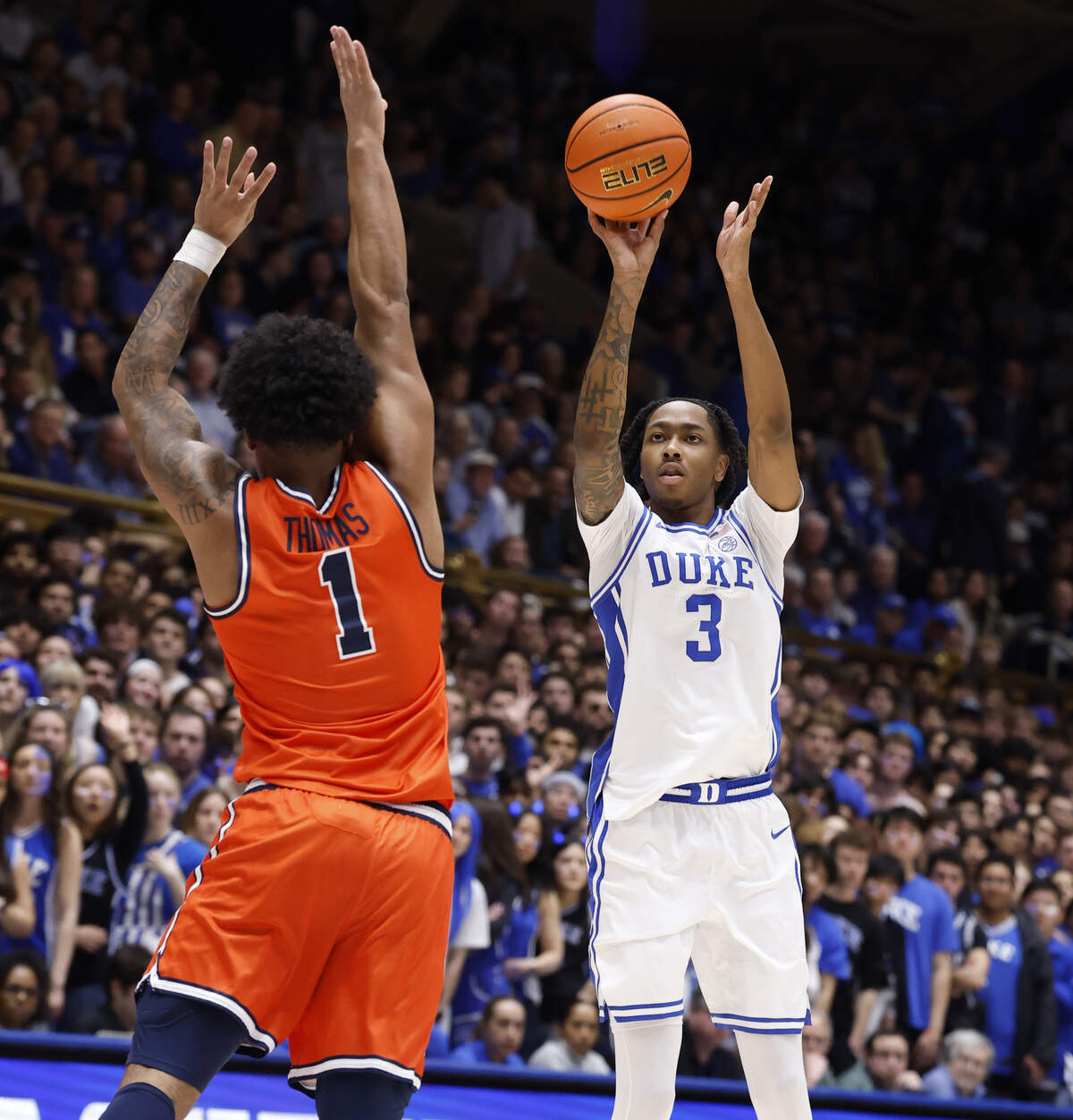 Duke’s Isaiah Evans (3) drills a three-pointer as Virginia's Malik Thomas (1) defends during the second half of Duke’s 77-51 victory over Virginia at Cameron Indoor Stadium in Durham, N.C., Saturday, Feb. 28, 2026.