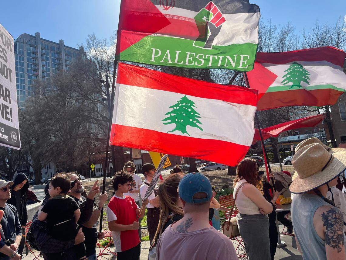 Demonstrators flew Palestinian and Lebanese flags as they marched in downtown Raleigh to protest the U.S. war in Iran.