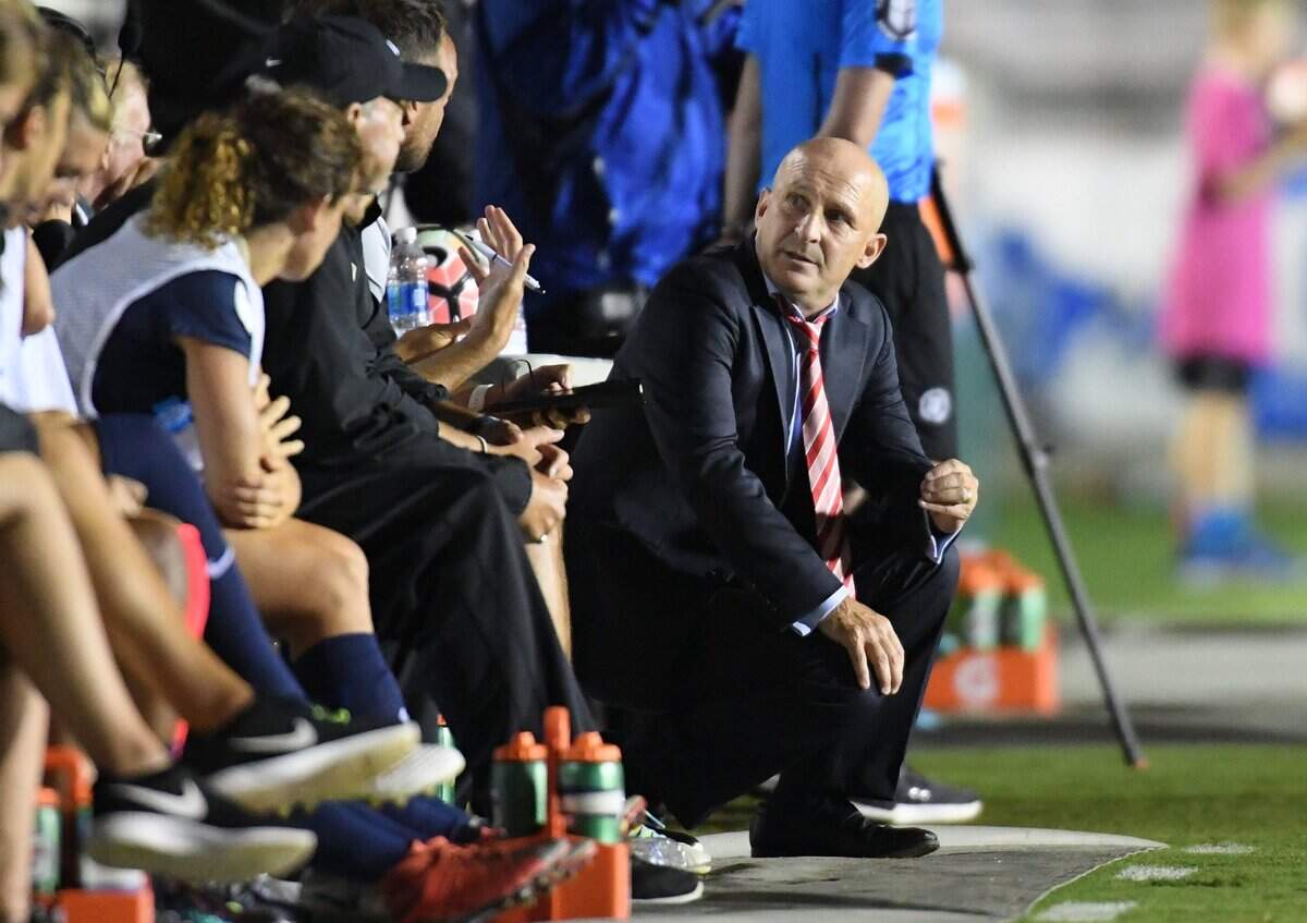 Paul Riley, right, head coach of North Carolina Courage talks to his bench during a 2017 game.