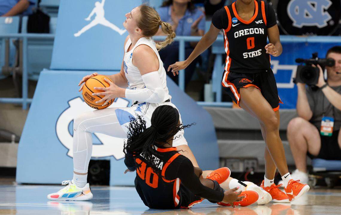 North Carolina’s Alyssa Ustby (1) is fouled after pulling a rebound from Oregon State’s Catarina Ferreira (30) during the first half of UNC’s game against Oregon State in the first round of the NCAA women’s basketball tournament at Carmichael Arena in Chapel Hill, N.C., Saturday, March 22, 2025.